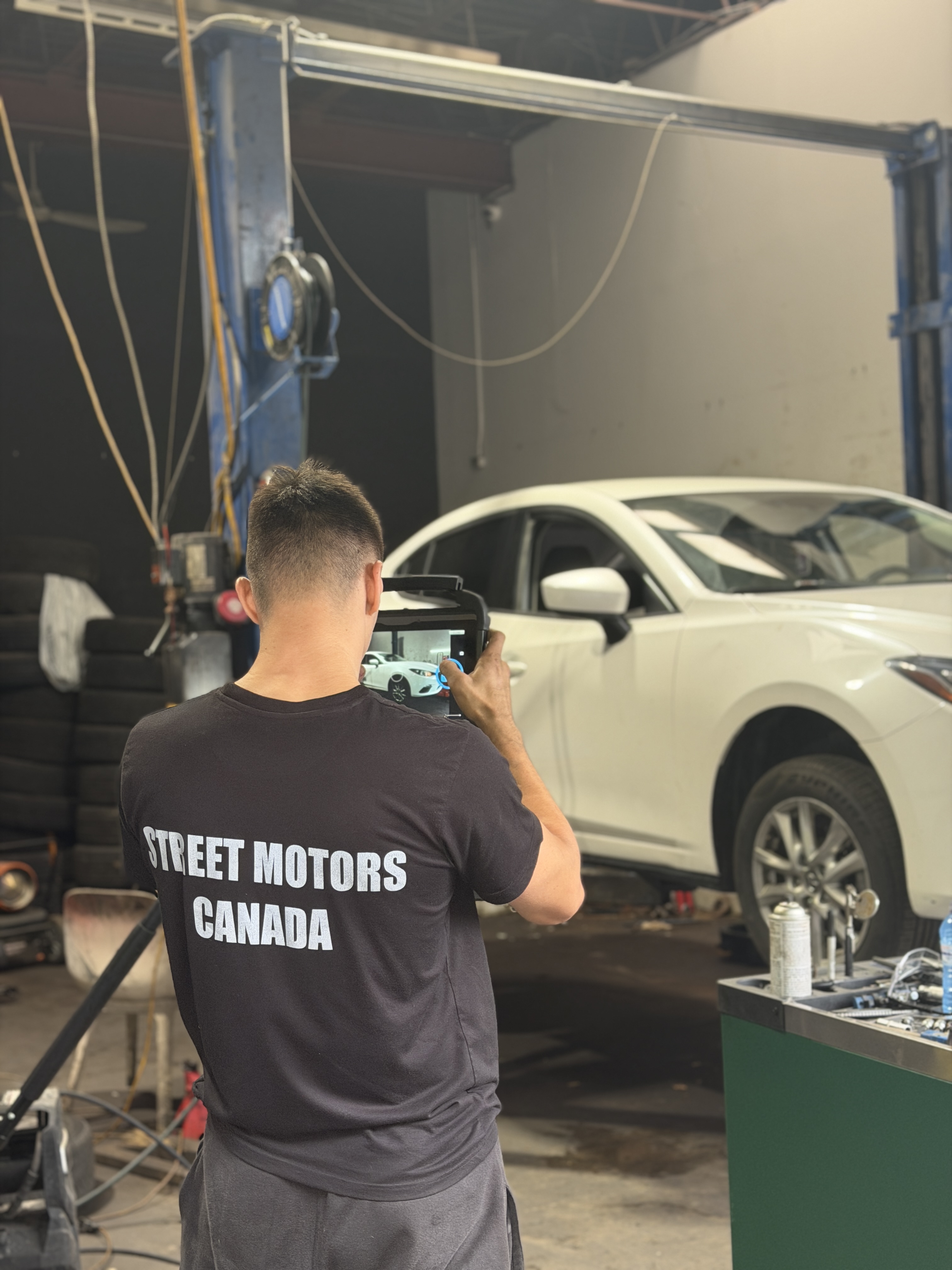 Street Motors Toronto mechanic running diagnostics — safety inspection Toronto